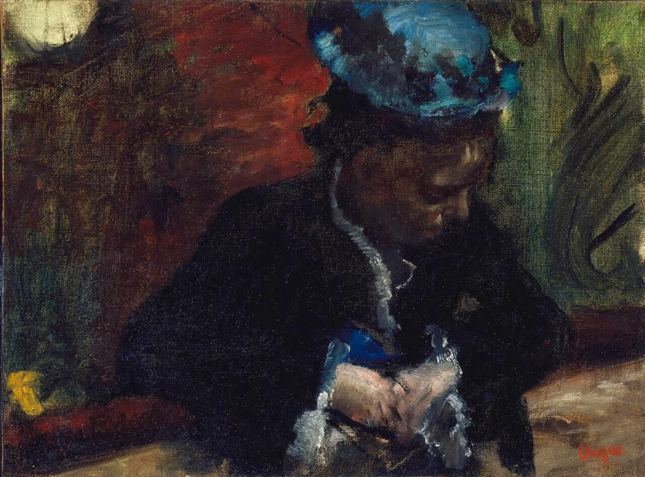 Au théâtre: femme assise au balcon