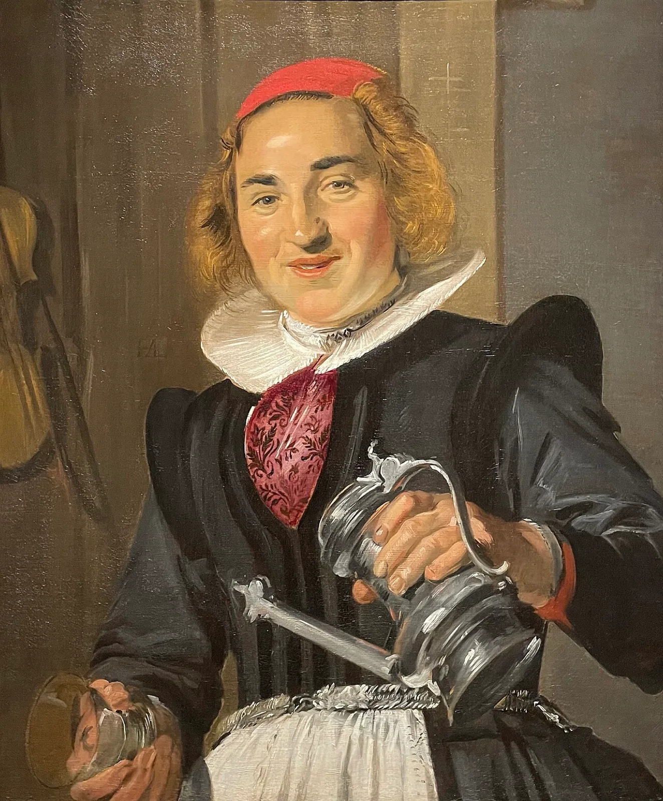 A young woman with a glass and flagon