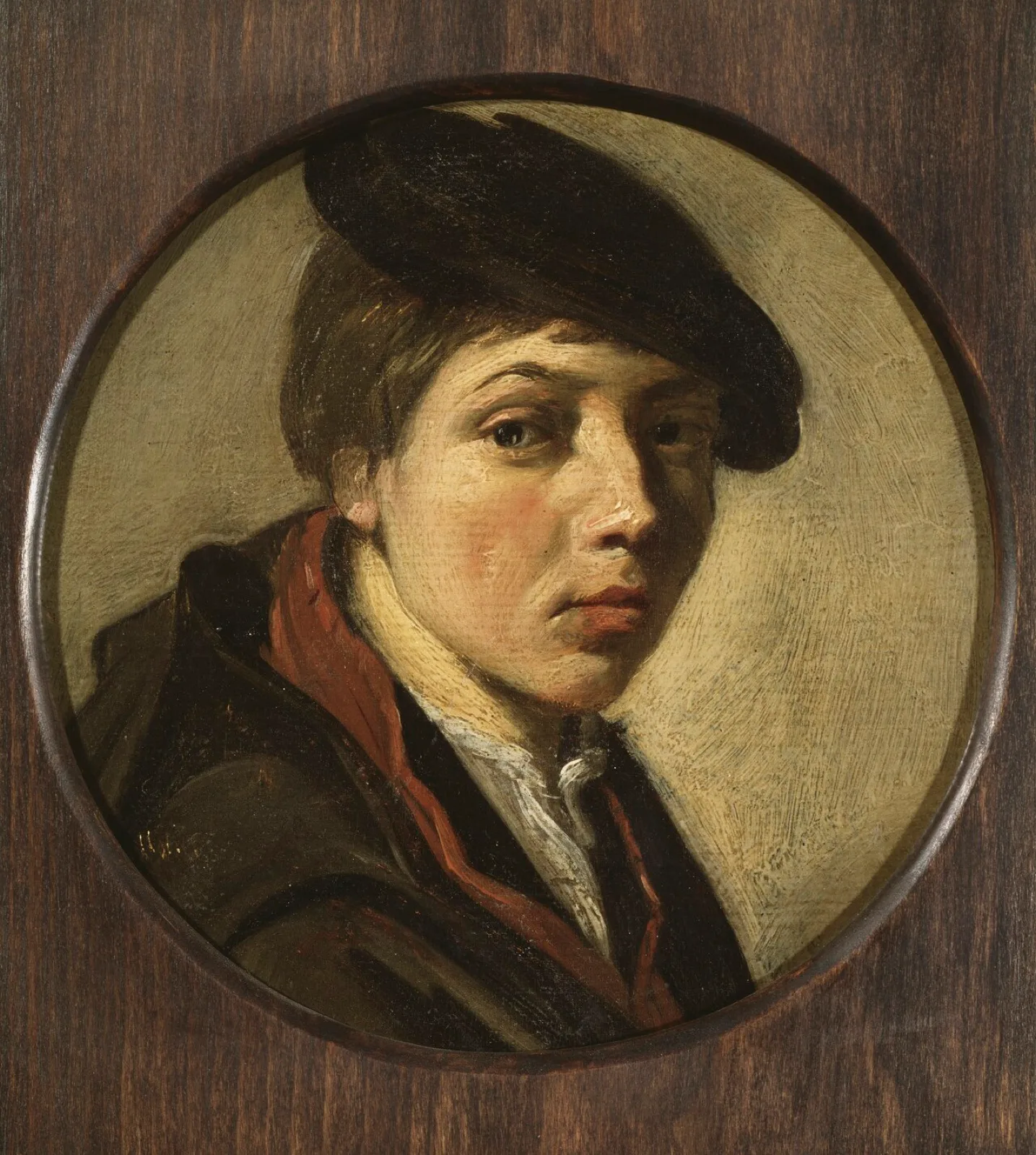 Round portrait of a boy with beret