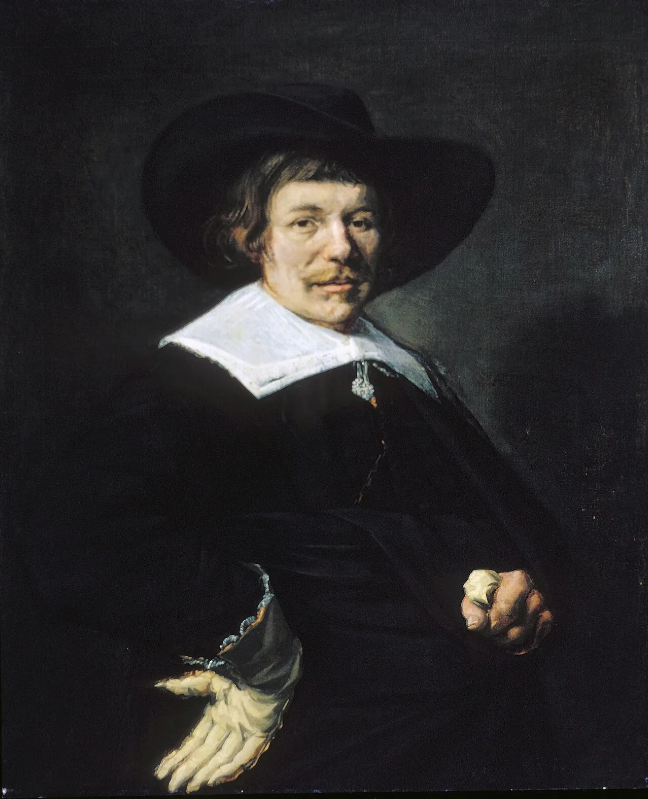 Portrait of a man with tassle collar and floppy hat