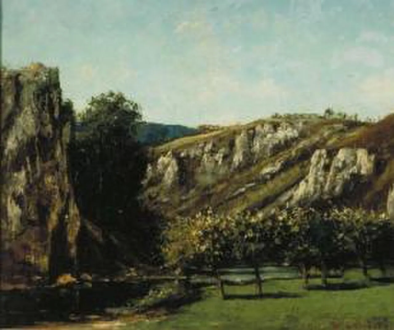 Mountainous landscape with fruit trees in Ornans