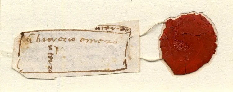 Diagram of a rectangular marble block inscribed with measurements and symbols