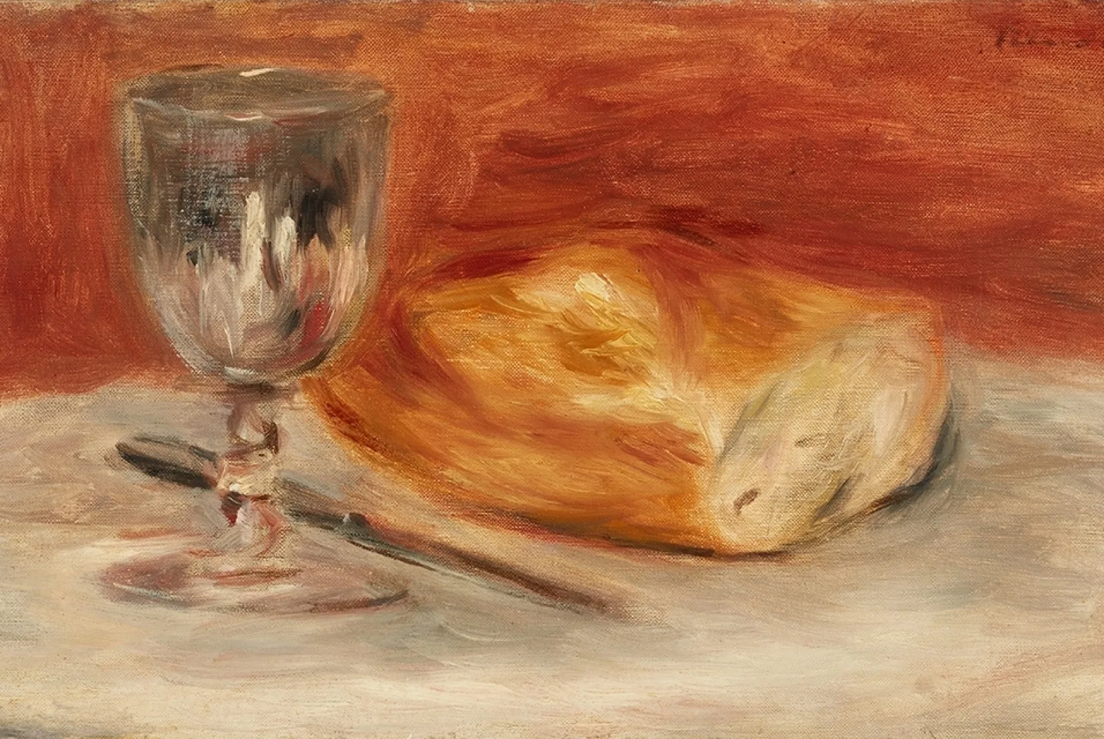 Still life with wine glass and a half loaf of bread