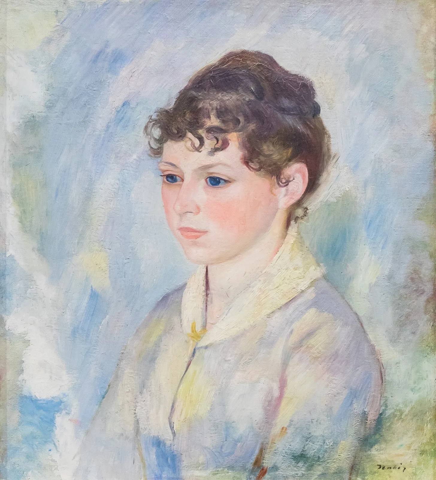 Tête de jeune fille sur fond bleu-clair