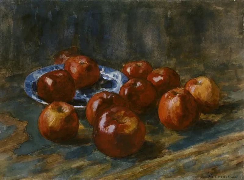 Apples on a table, two on a plate