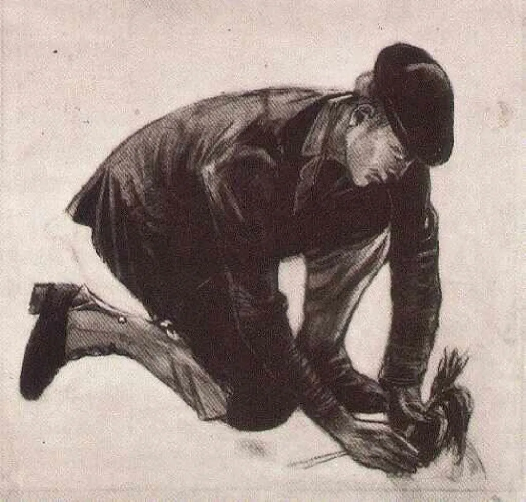 A kneeling man planting