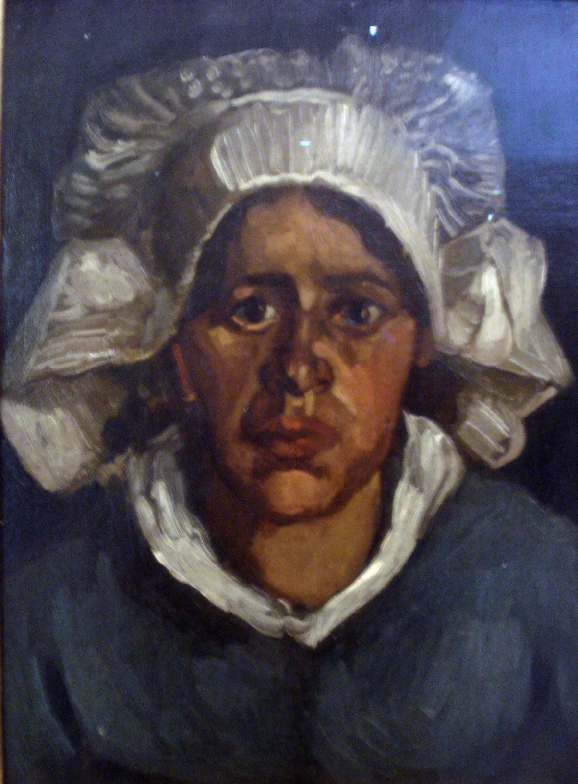 Head of a peasant woman with white cap: full face