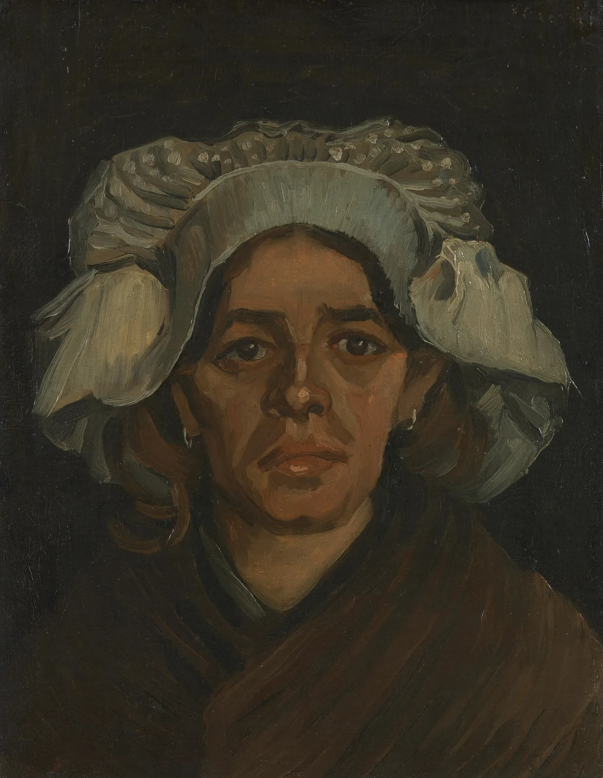 Head of a peasant woman with white cap: front view