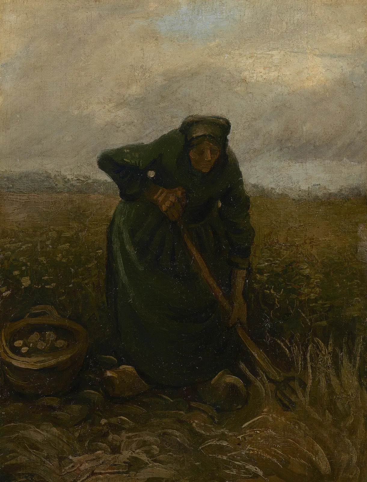 Peasant woman digging potatoes