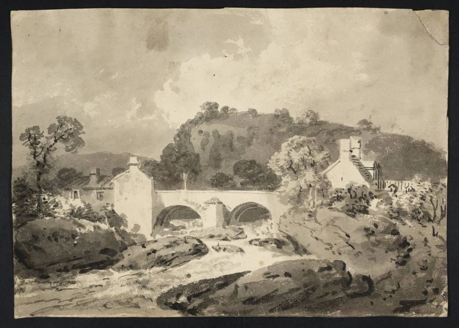 A Bridge over a River, with Buildings on Each Bank and a Cliff Beyond